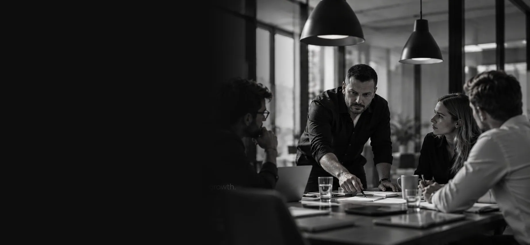 Black-and-white team strategy meeting with Moonwalk founder